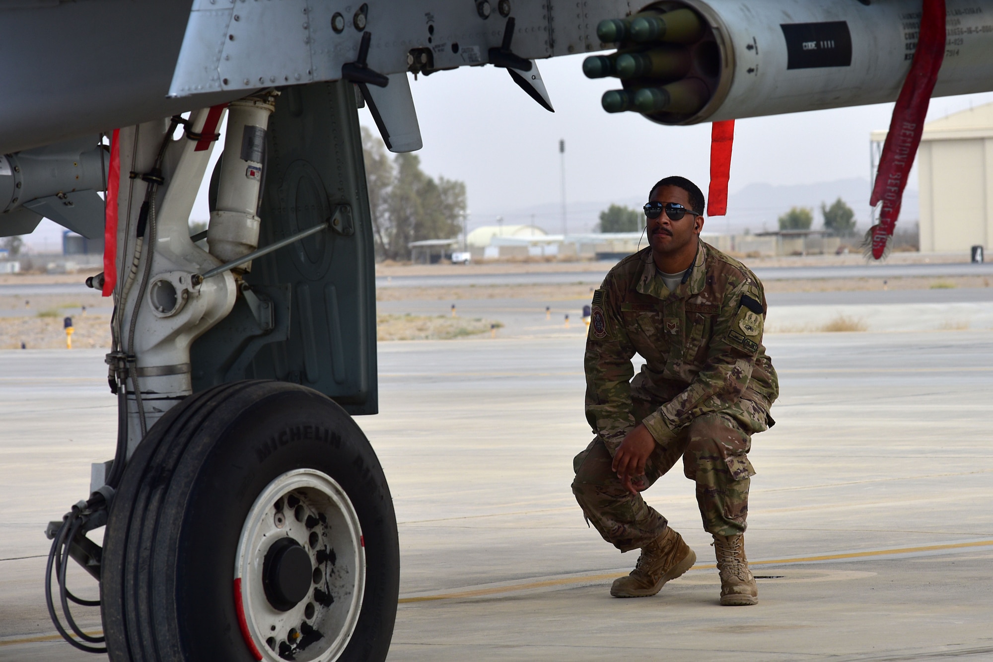 Staff Sgt. Todd Regas and Tech. Sgt. Joeseph Embrey, maintenance Airmen assigned to the 303rd Expeditionary Fighter Squadron, inspect an engine on the A-10 Thunderbolt II after a flight at Kandahar Airfield, Afghanistan, Feb. 27, 2018.