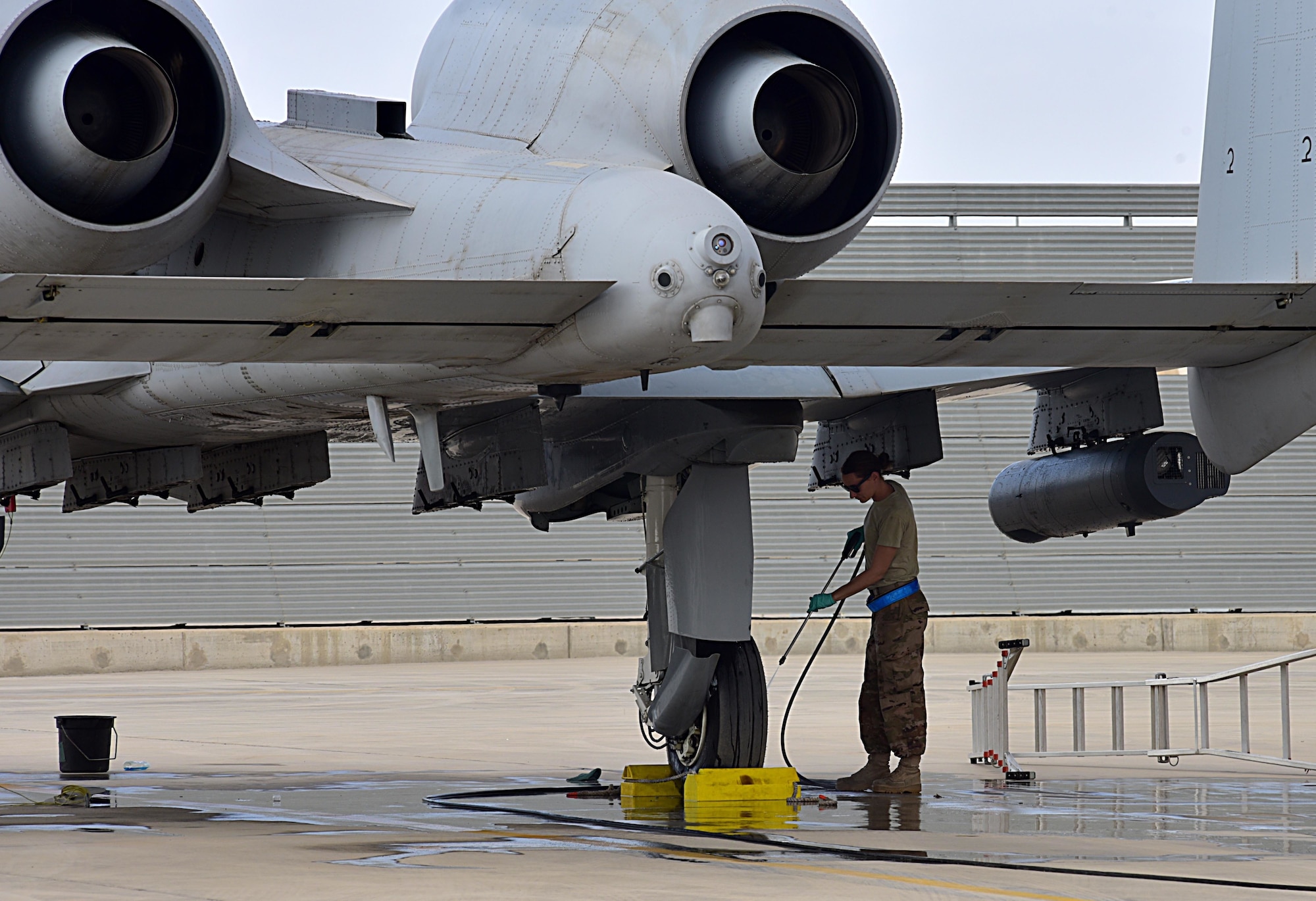 Senior Airman Victoria Toole, 303rd Expeditionary Aircraft Fighter Squadron crew chief, washes her aircraft on the flight line at Kandahar Airfield, Afghanistan, Feb. 27, 2018.