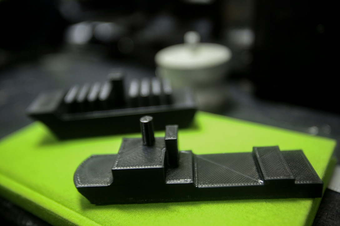 A 3-D printed model of the dock landing ship USS Oak Hill (LSD 51) and a cargo ship, made for terrain models aboard the amphibious assault ship USS Iwo Jima (LHD 7) in the Atlantic Ocean, Feb. 21, 2018.