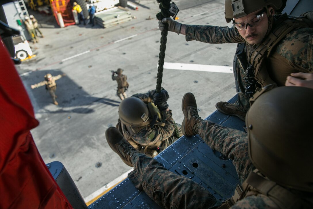 ATLANTIC OCEAN (February 26, 2018) U.S. Marines assigned to the Maritime Raid Force (MRF), 26th Marine Expeditionary Unit (MEU), conduct fast rope training aboard the Wasp-class amphibious assault ship USS Iwo Jima (LHD 7), Feb. 26, 2018. Iwo Jima and the 26th MEU are conducting naval operations in the U.S. 6th Fleet area of operations. (U.S. Marine Corps photo by Cpl. Jered T. Stone/Released)