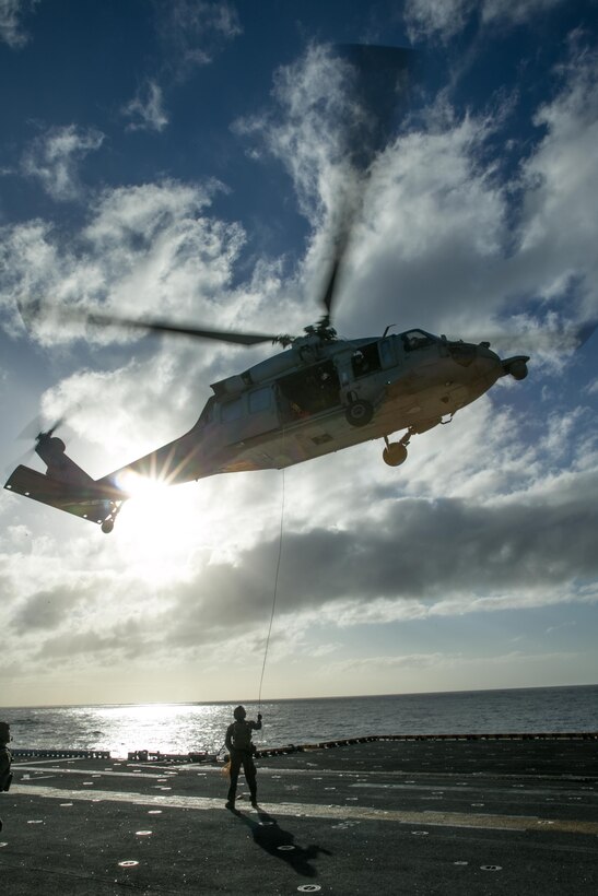 ATLANTIC OCEAN (February 26, 2018) U.S. Marines assigned to the Maritime Raid Force (MRF), 26th Marine Expeditionary Unit (MEU), conduct fast rope training from an MH-60S Sea Hawk, attached to Helicopter Sea Combat Squadron (HSC) 28, aboard the Wasp-class amphibious assault ship USS Iwo Jima (LHD 7), Feb. 26, 2018.