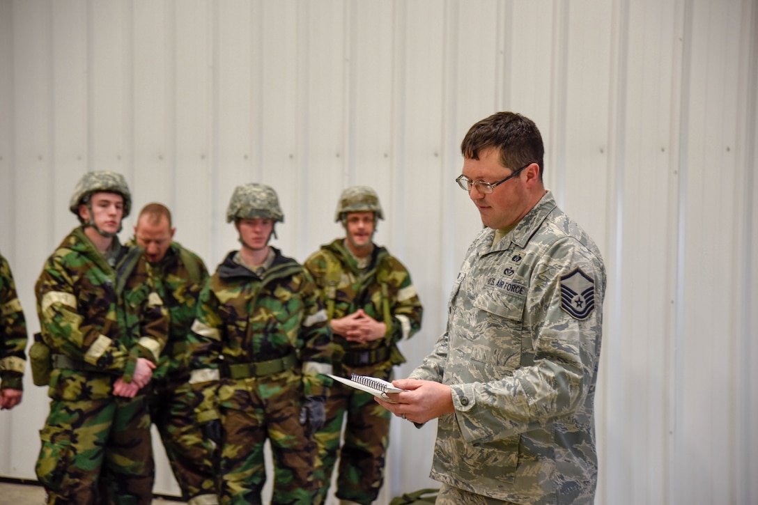 Master Sgt. Brian LeBrun,  114th Civil Engineer Squadron emergency manager, explains the proper procedure of identifying unexploded ordinances during a post attack reconnaissance (PAR) sweep during the 114th Fighter Wing Readiness Training March 3, 2018, Joe Foss Field, S.D.