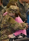 Master Sgt. Nichole Gruber, 114th Civil Engineer Squadron first sergeant, hugs her daughter during a welcome home ceremony March 4, 2018 at Joe Foss Field.