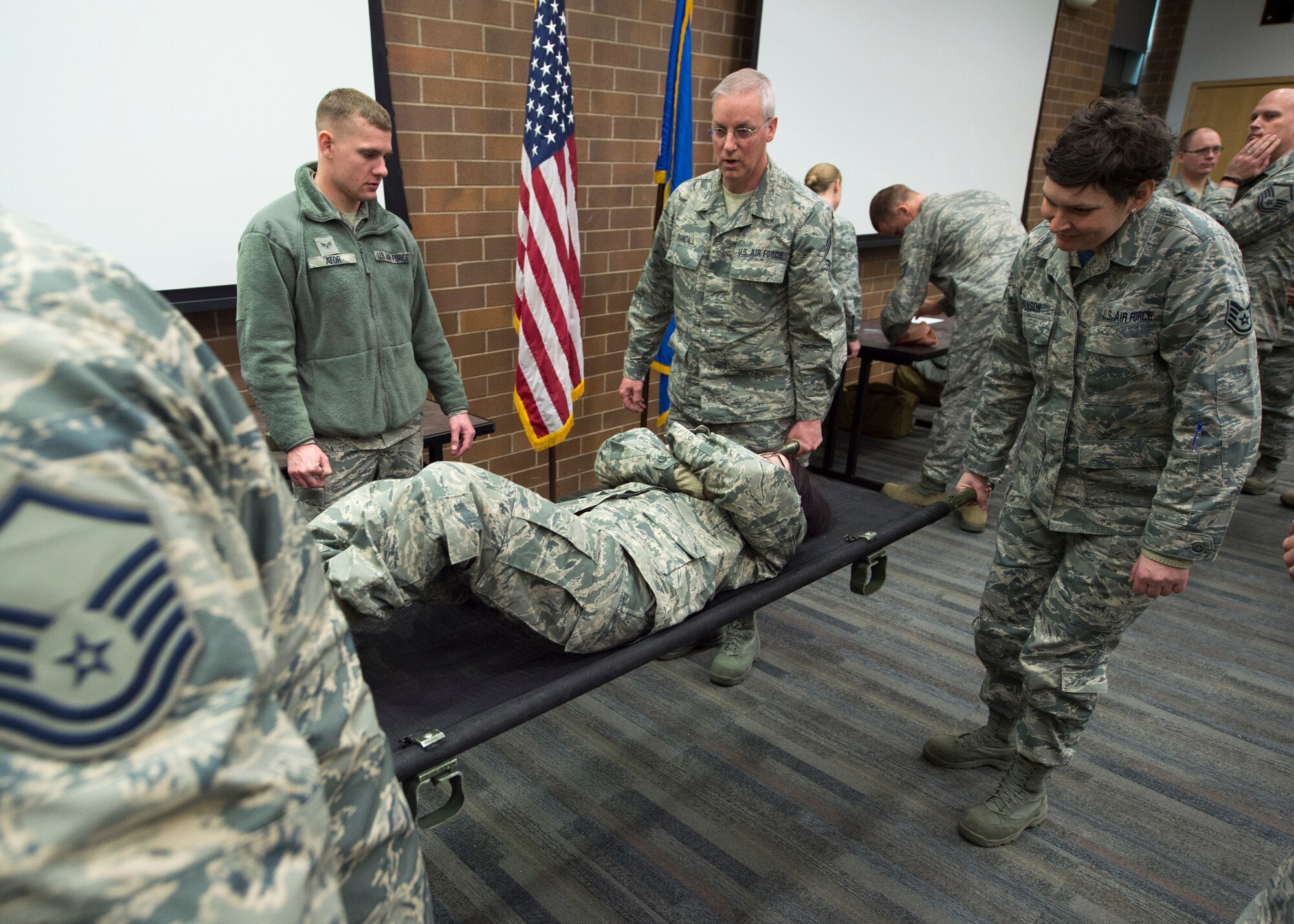 U.S. Air Force Airmen with the 133rd Airlift Wing partake in a self-aid buddy care class St. Paul, Minn., Feb. 24, 2018.