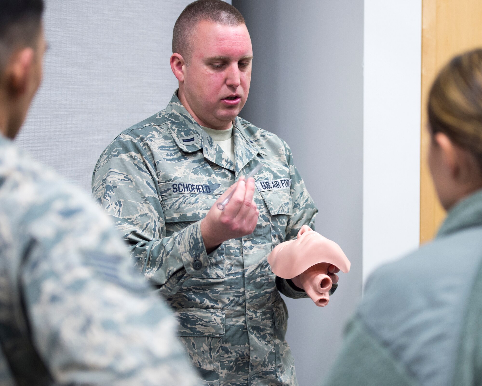 U.S. Air Force Airmen with the 133rd Airlift Wing partake in a self-aid buddy care class St. Paul, Minn., Feb. 24, 2018.