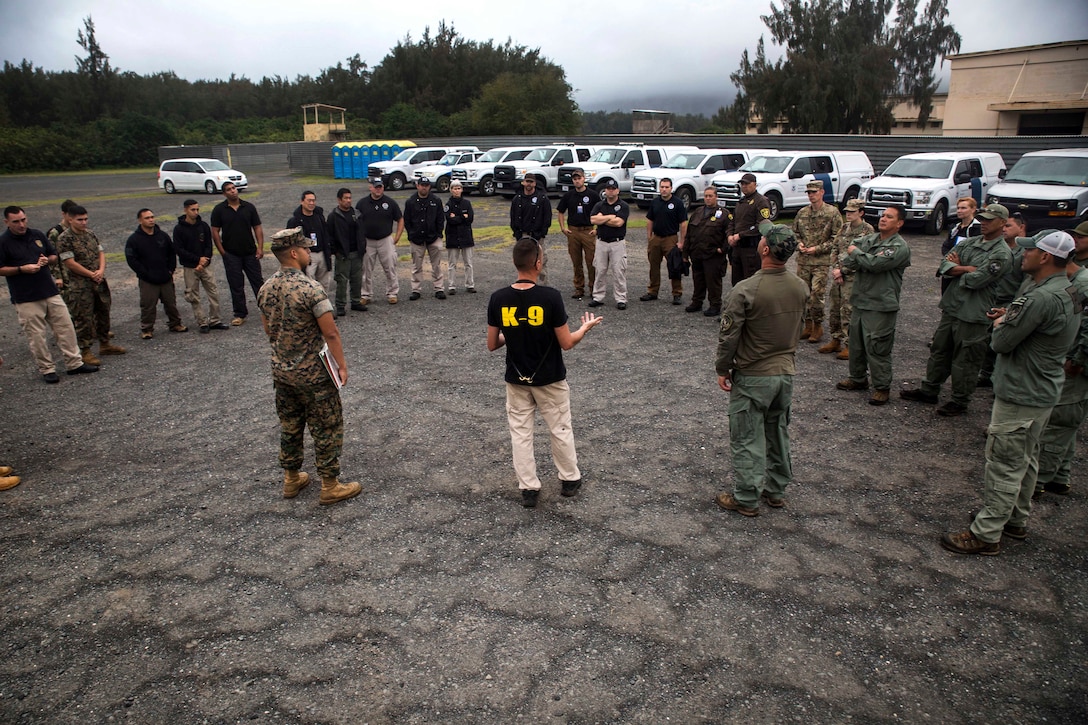 Marines and Transportation Security Administration agents receive a training brief.