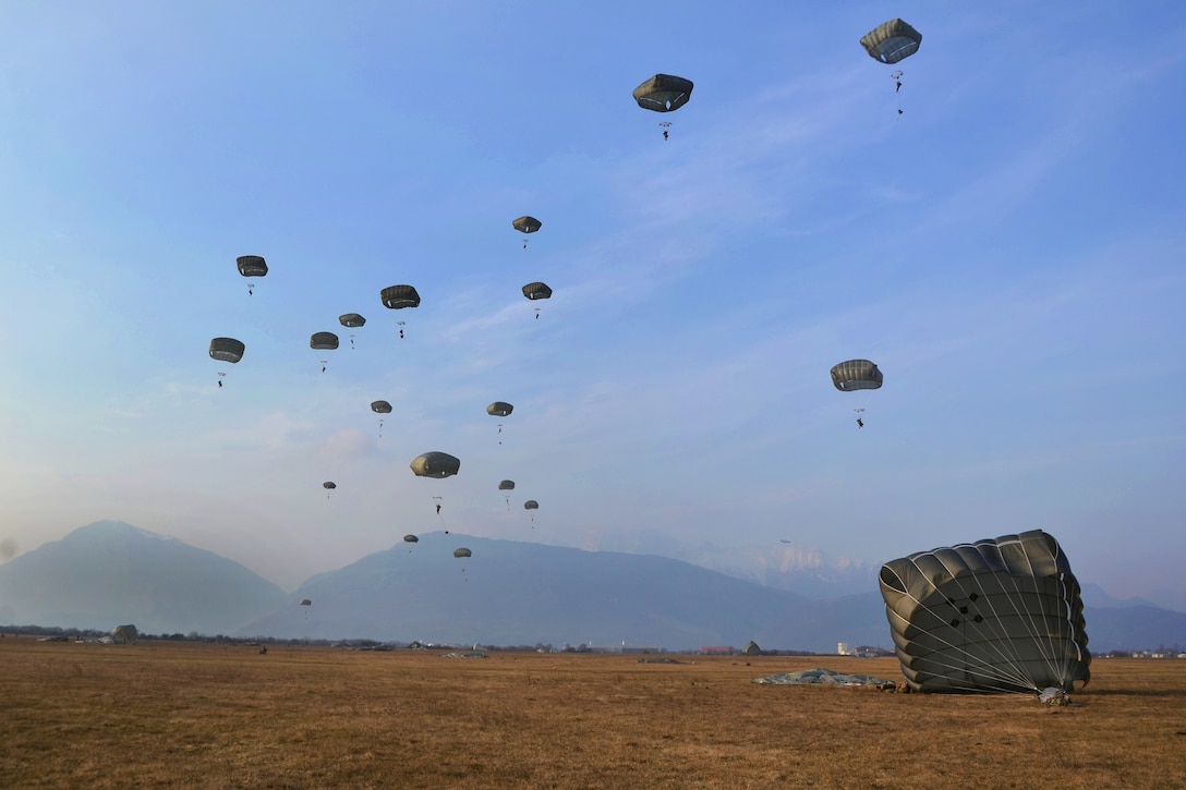 U.S. and Italian soldiers conduct an airborne operation.