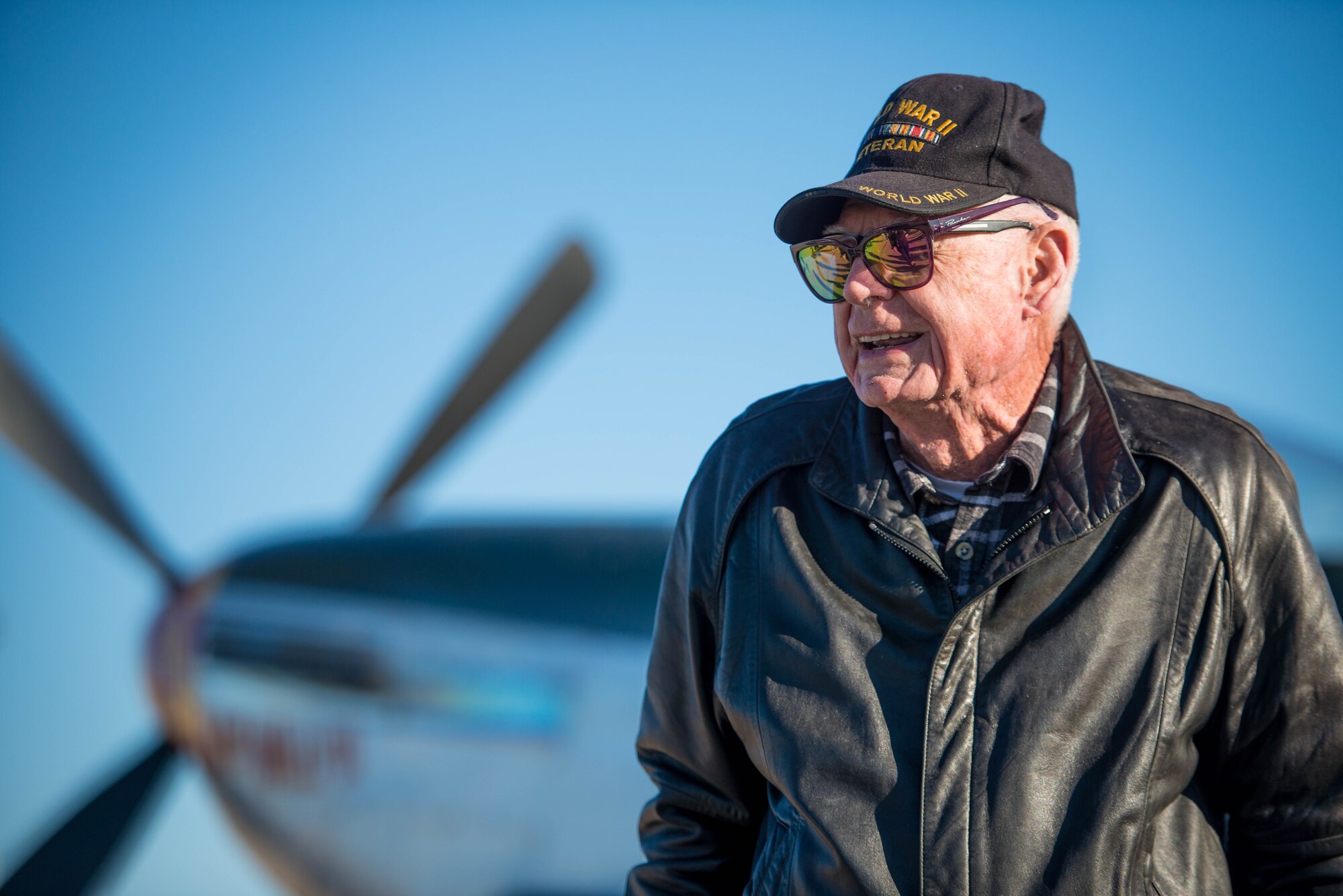 Deane Mitchell, a World War II veteran, pilot, tours a vintage P-51 Mustang
