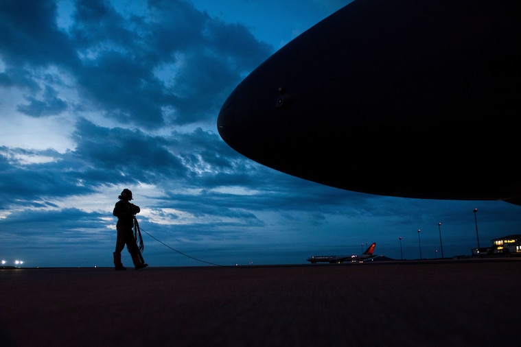 Airmen load cargo onto a C-5M Super Galaxy aircraft during a Tuskegee Airmen heritage flight at the Robert Gray Army Airfield in Killeen, Texas, Feb. 25, 2018. Photos by Air Force Master Sgt. Joey Swafford  