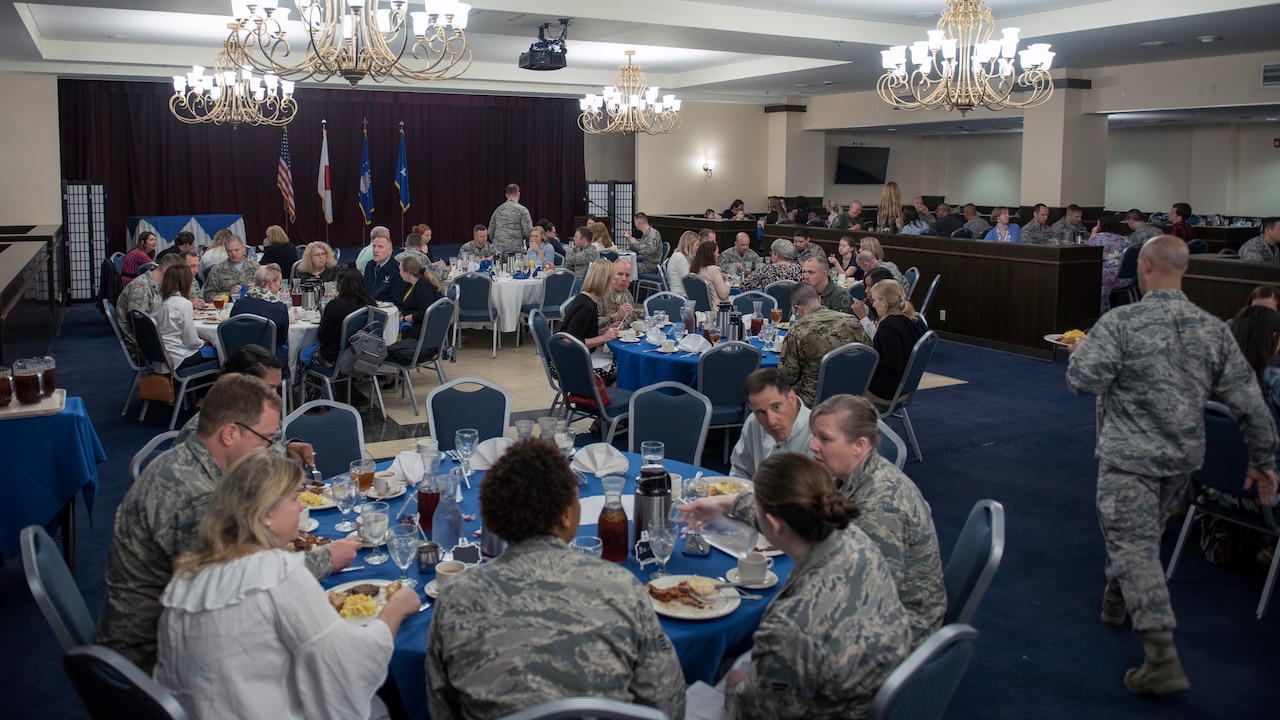 Attendees listen to an announcement during a Key Spouse appreciation luncheon at Kadena Air Base, Japan, March 2, 2018. Key Spouses are commander-appointed and serve as a resource as part of efforts to support Air Force families. Air Force photo by Airman 1st Class Greg Erwin
