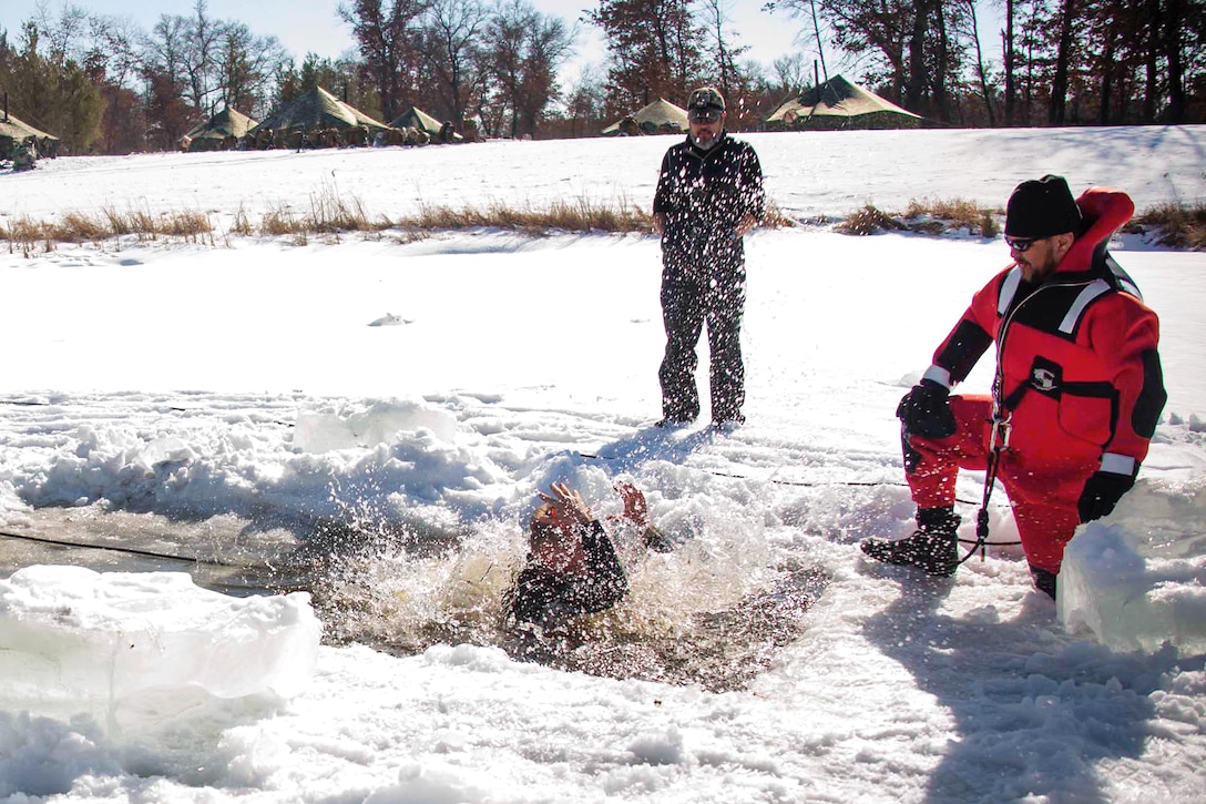 Lt. Col. Lawrence B. Green splashes around after jumping into freezing water as part of cold-water immersion training.