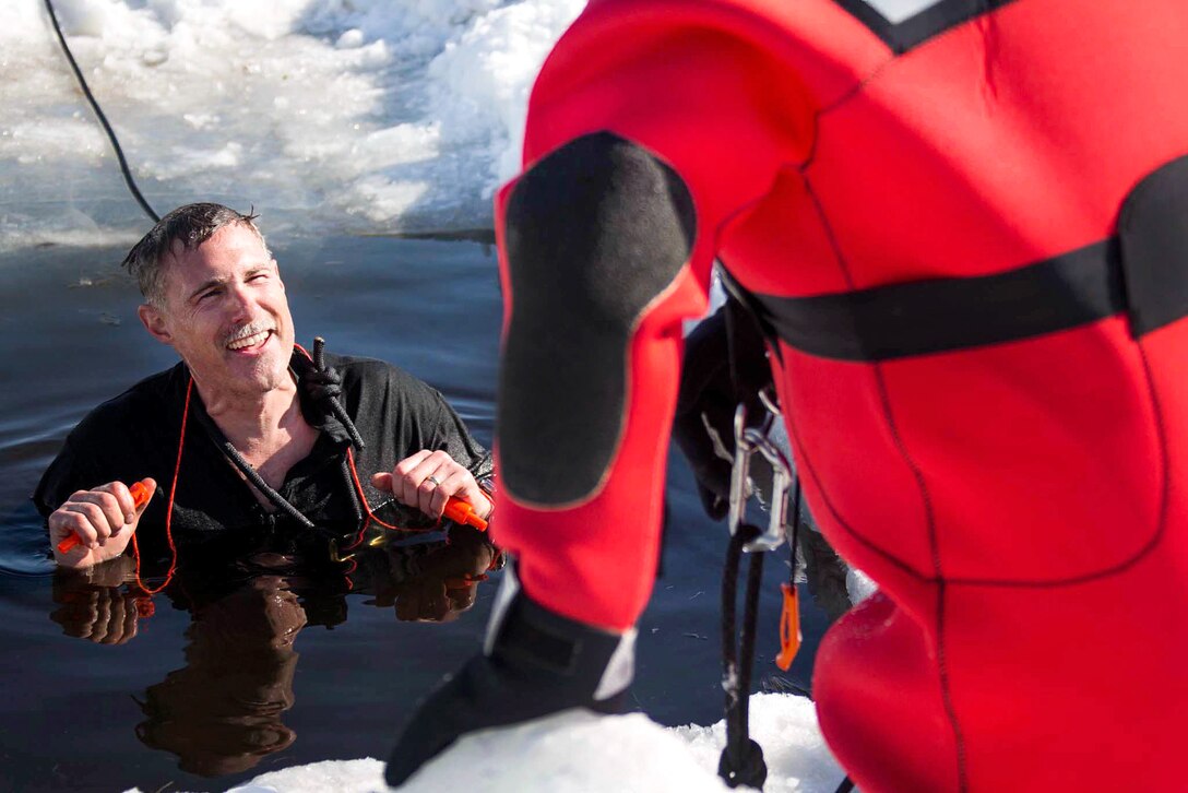 Lt. Col. Lawrence B. Green stands in freezing water as part of cold-water immersion training.