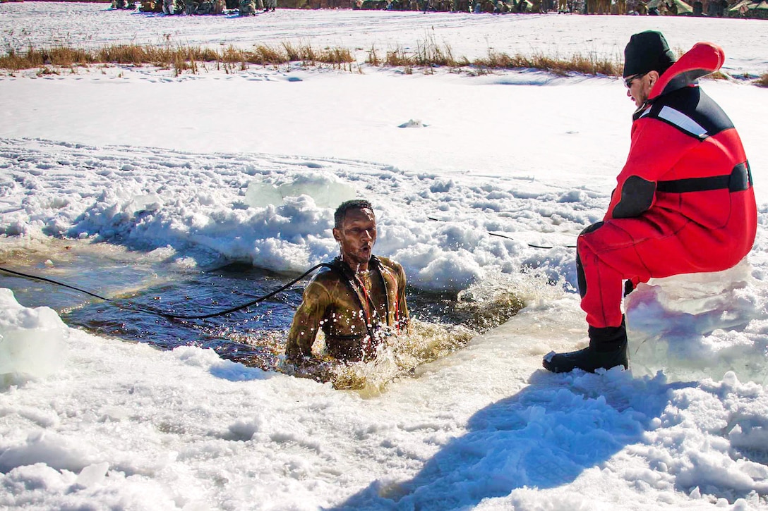 Sgt. Kennard Jones jumps into freezing water as part of cold-water immersion training.