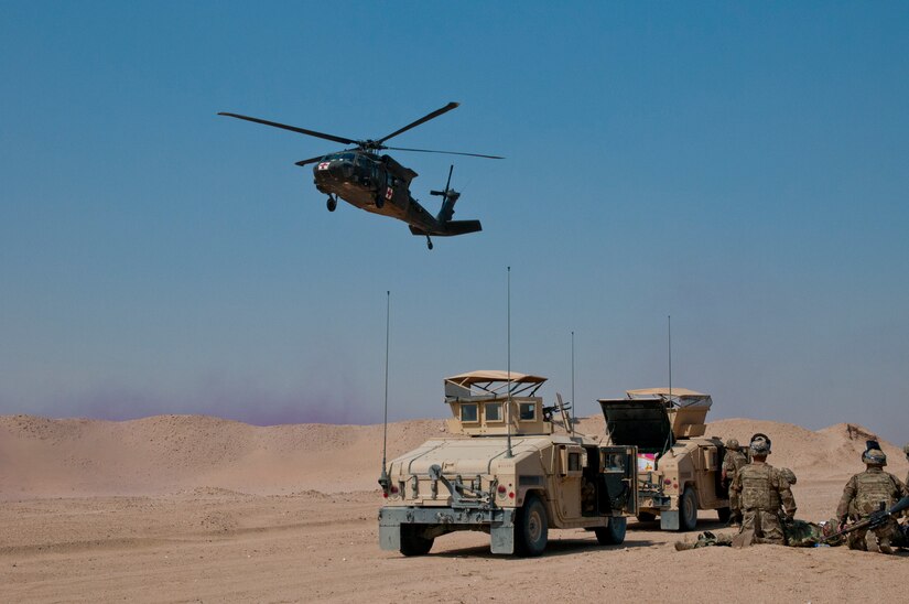 A UH-60 Black Hawk air ambulance takes off with simulated casualties from Delta Battery, 1st Battalion, 145th Field Artillery Regiment, Utah National Guard, during training on Gerber Training Area, Udairi Range Complex, Kuwait, Feb. 26, 2018. The exercise included an IED lane and enemy fire in a hostile village before culminating in the simulated medical evacuation with a UH-60 Black Hawk air ambulance.