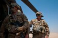 Noncommissioned officers with Delta Battery, 1st Battalion, 145th Field Artillery Regiment, Utah National Guard, watch a UH-60 Black Hawk air ambulance crew load simulated casualties into the helicopter during training on Gerber Training Area, Udairi Range Complex, Kuwait, Feb. 26, 2018. The exercise included an IED lane and enemy fire in a hostile village before culminating in the simulated medical evacuation.