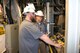 Ryan Allen, at right, a lead test operations engineer, and Troy Stokes, lead outside machinist, set up a GN2 panel for system checkouts prior to a test in one of the jet engine test facilities at Arnold Air Force Base. In his position as operations engineer, Allen leads and coordinates activities of the test cell, plant and test article during a test. (U.S. Air Force photos/Deidre Ortiz)