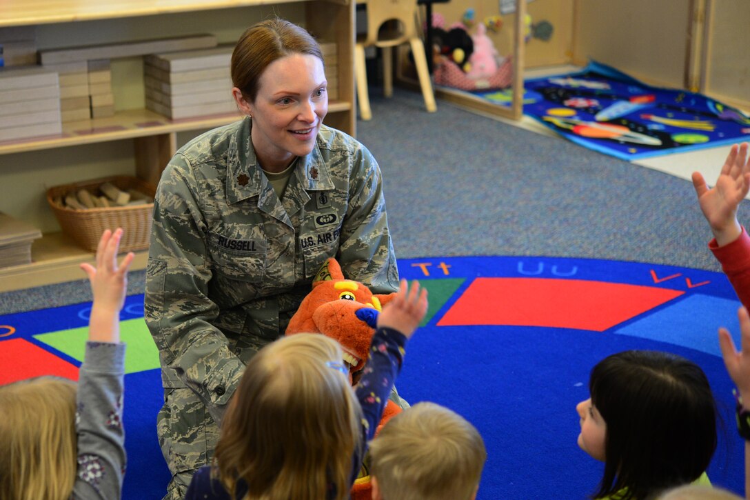 Maj. Amber Russell, 341st Medical Group general dentist, visits the child development center to inform children about dental health Feb. 21, 2018, at Malmstrom Air Force Base, Mont.