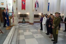 U.S. and New Zealand officials, including Admiral Harry Harris; Ambassador Scott Brown; New Zealand Minister of Defence, Hon. Ron Mark; and Chief of the New Zealand Defence Force, Lt. Gen. Tim Keating view design renderings of the U.S. monument to be installed at Pukeahu National War Memorial, Wellington, New Zealand.