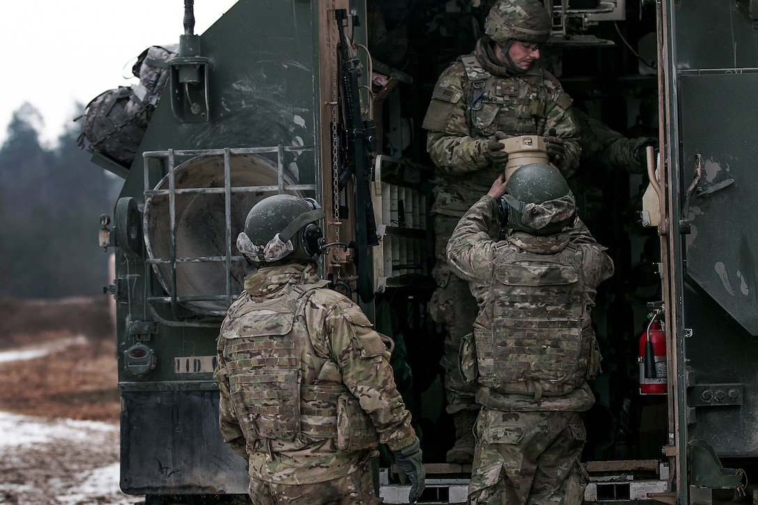 Soldiers return expended ammunition during training exercise.