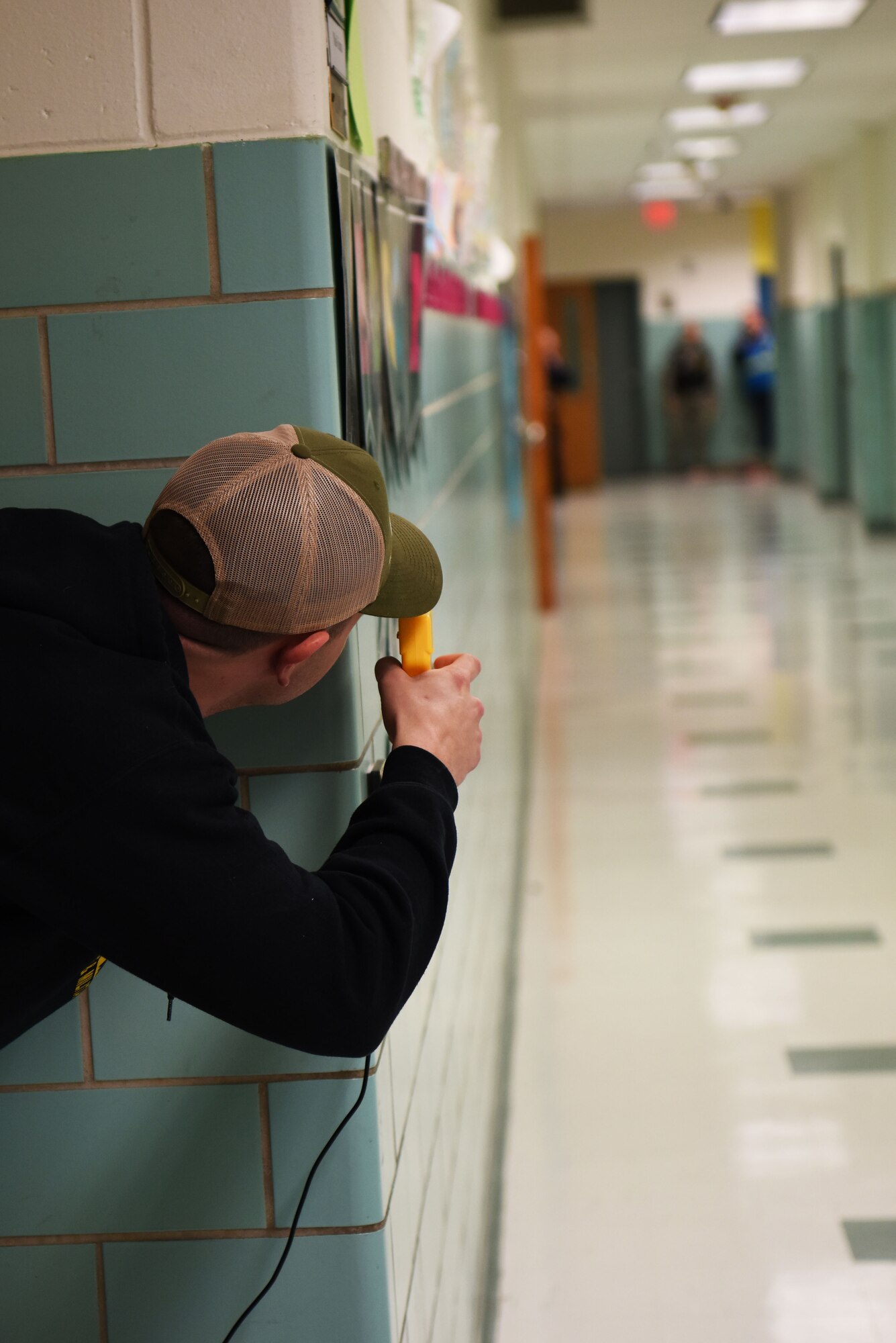 Staff Sgt. Bernard Pecoraro, 436th Security Forces Squadron military working dog handler, acts as a gunman during an active shooter exercise at the George S. Welch Elementary School and Dover Air Force Base Middle School Feb. 26, 2018, on Dover AFB, Del. The exercise was meant to train and evaluate the response of Security Forces to an actual event. (U.S. Air Force photo by Airman 1st Class Zoe M. Wockenfuss)