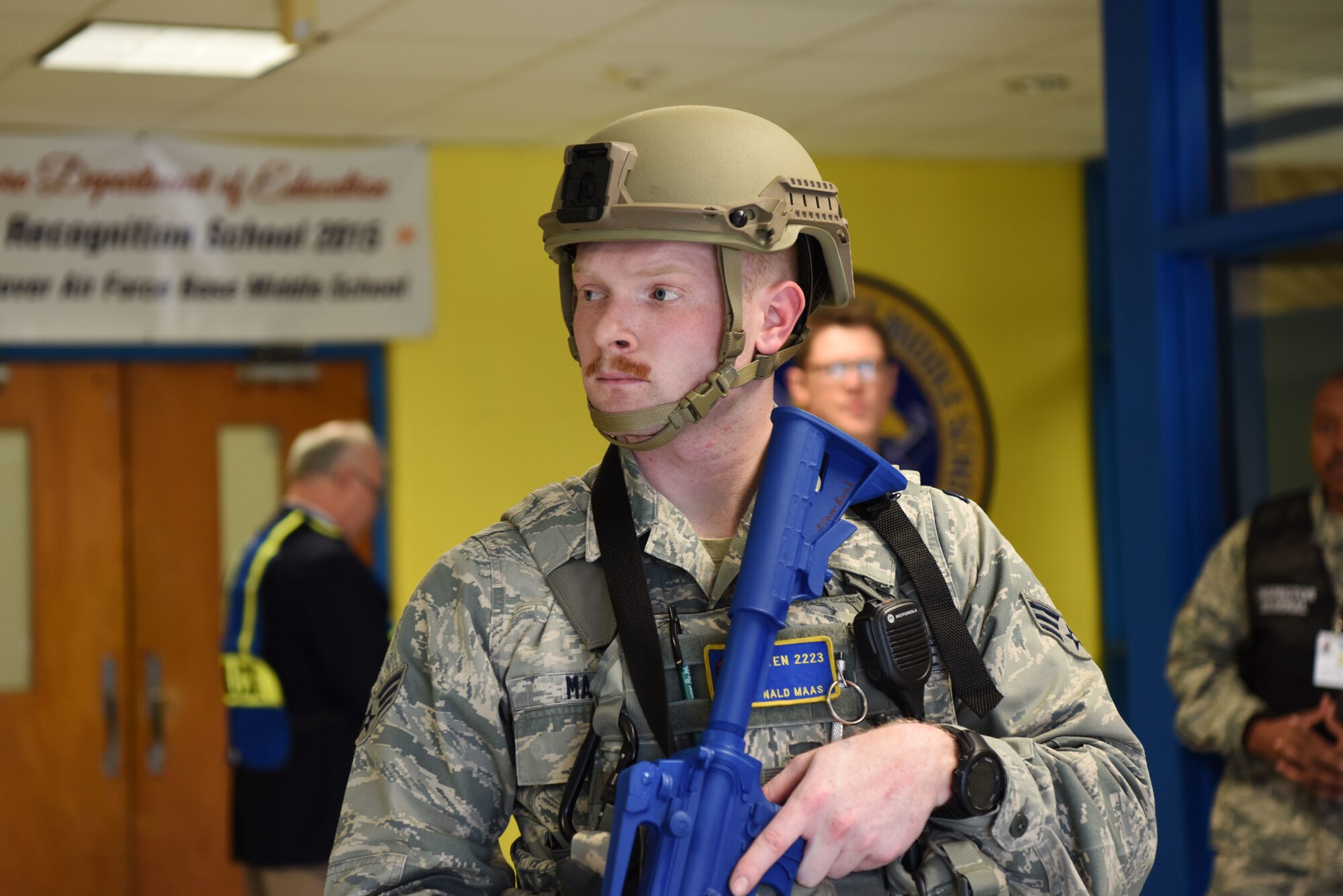 Senior Airman Donald Maas, 436th Security Forces Squadron raven, stands guard in the George S. Welch Elementary School during an active shooter exercise Feb. 26, 2018, at Dover Air Force Base, Del. Every member of Security Forces, no matter the rank, is responsible for knowing and understanding the response procedures in the event of a real-world active shooter. (U.S. Air Force photo by Airman 1st Class Zoe M. Wockenfuss)