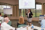 Meg Reyes, Joint Base San Antonio Community Initiatives director, addresses attendees at the Air Installations Compatible Use Zones Program conference at Joint Base San Antonio-Fort Sam Houston Feb. 27. The Air Force Civil Engineer Center hosted event brought AICUZ personnel from all around the Department of Defense, as well as representatives from the Office of Economic Adjustment and Department of Agriculture to discuss and share best practices with each other. The overall goal of the program is to protect the health, safety and welfare of those living and working on or near military installations while ensuring the continued flight operations.