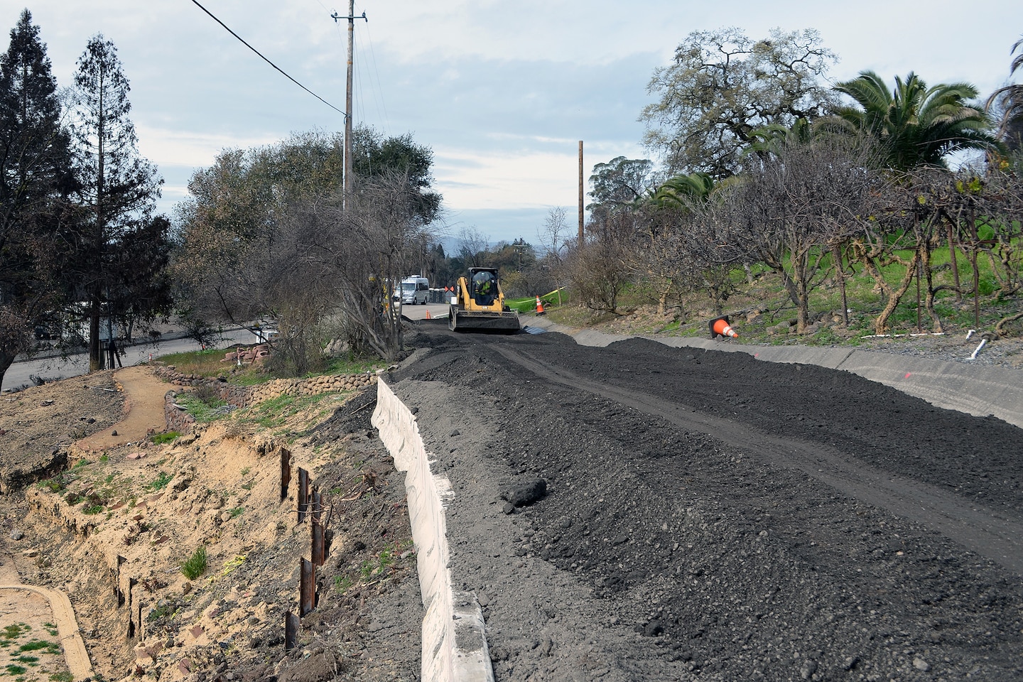 In order to make this road usable, contractors brought in fill dirt and rock, graded and widened the stretch of the road, and turned an unsafe road into one that could support trucks and other heavy equipment. (U.S. Army photo by J. Paul Bruton/Released)