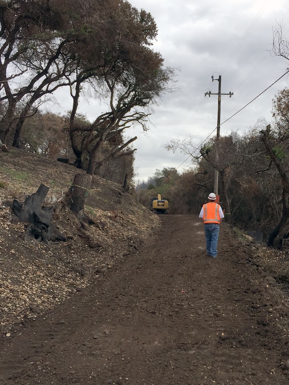 Sacramento District’s Mark Swenson looks over a newly graded road created to give contractors access to 21 previously inaccessible properties. (U.S. Army photo by J. Paul Bruton/Released)