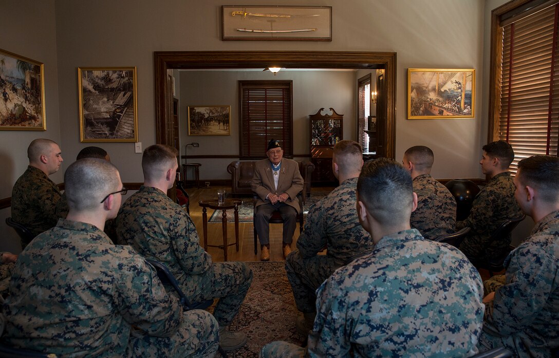 Hershel “Woody” Williams, the last living Medal of Honor recipient from the Battle of Iwo Jima and retired Marine Chief Warrant Officer 4, speaks to Barracks’ Marines in Center House at Marine Barracks Washington D.C., Feb. 28, 2018. Marines of MBW met with Williams at Center House for a meet and greet and were afforded the opportunity to listen to stories shared from their fellow Marine. Williams received the Medal of Honor for his “valiant devotion to duty” and service above self as he “enabled his company to reach its objective” on the island of Iwo Jima during World War II. (Official Marine Corps photo by Cpl. Robert Knapp/Released)