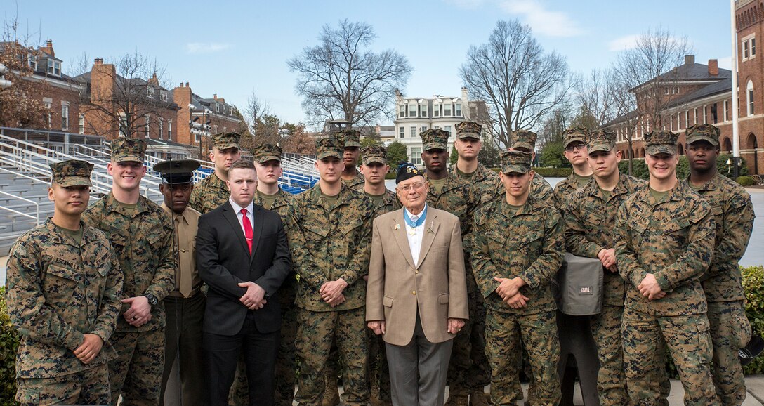Hershel “Woody” Williams, the last living Medal of Honor recipient from the Battle of Iwo Jima and retired Marine Chief Warrant Officer 4, poses for a photo with Barracks’ Marines at Marine Barracks Washington D.C., Feb. 28, 2018. Marines of MBW met with Williams at Center House for a meet and greet and were afforded the opportunity to listen to stories shared from their fellow Marine. Williams received the Medal of Honor for his “valiant devotion to duty” and service above self as he “enabled his company to reach its objective” on the island of Iwo Jima during World War II. (Official Marine Corps photo by Cpl. Robert Knapp/Released)