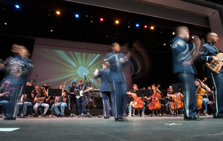 Musicians from the rock music group “Mobility” of The United States Air Force Band of the Golden West, Travis Air Force Base, Calif., perform with the Napa Valley Youth Symphony at the Veteran’s Home in Yountville, Calif., March 4, 2018. The band and symphony are performing together after the original concert, scheduled in October 2017, was canceled due to devastating wildfires in Napa and Sonoma counties. (U.S. Air Force photo by Louis Briscese)