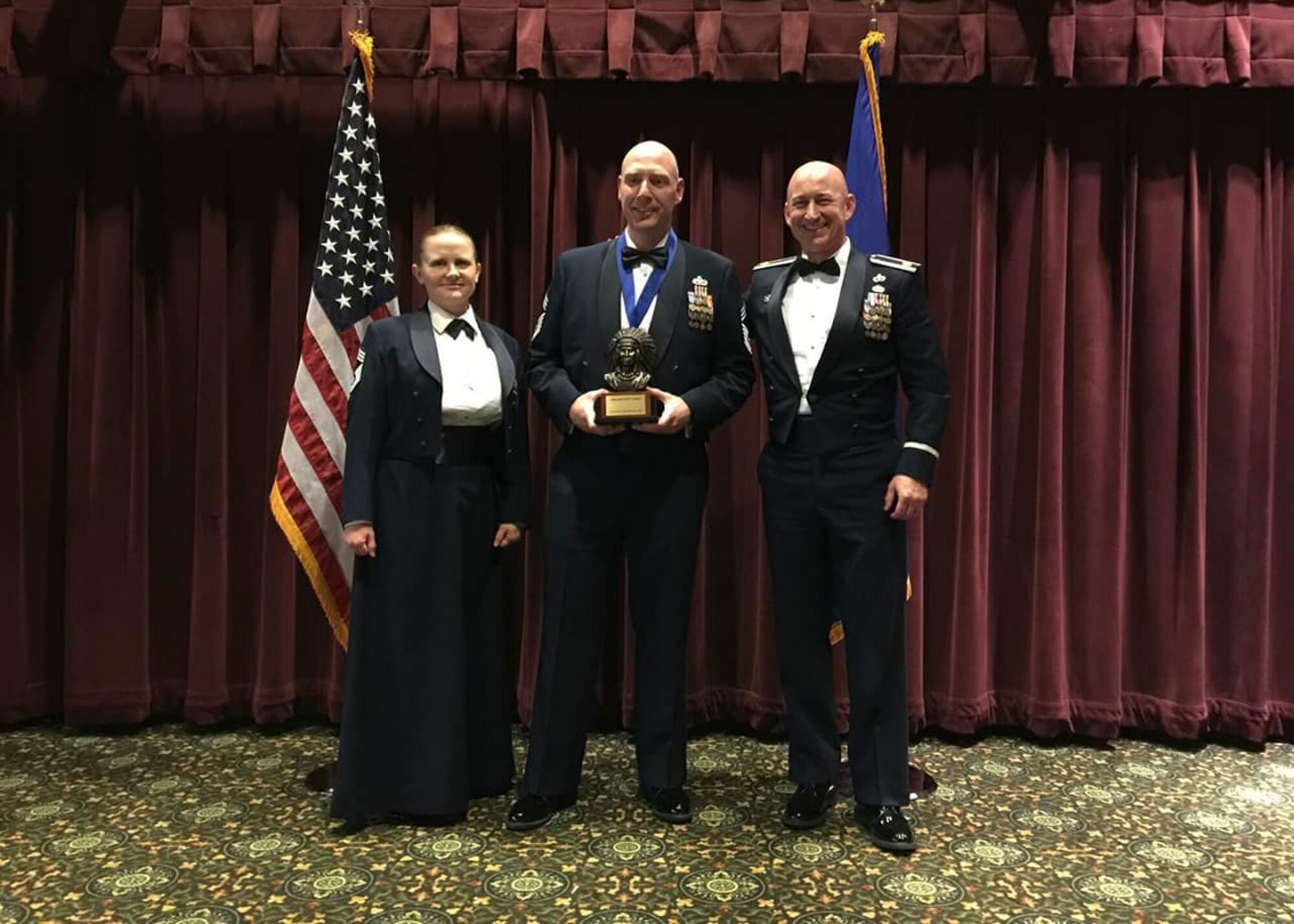 Chief Master Sgt. Marshall Stokoe (center), 446th Aerial Port Squadron, is recognized as one of the newest chiefs during the 24th annual Team McChord Chief's Induction Ceremony Feb. 8 at the McChord Field club. Stokoe is one of four Rainier Wing airmen promoted to the highest enisted rank in the Air Force.