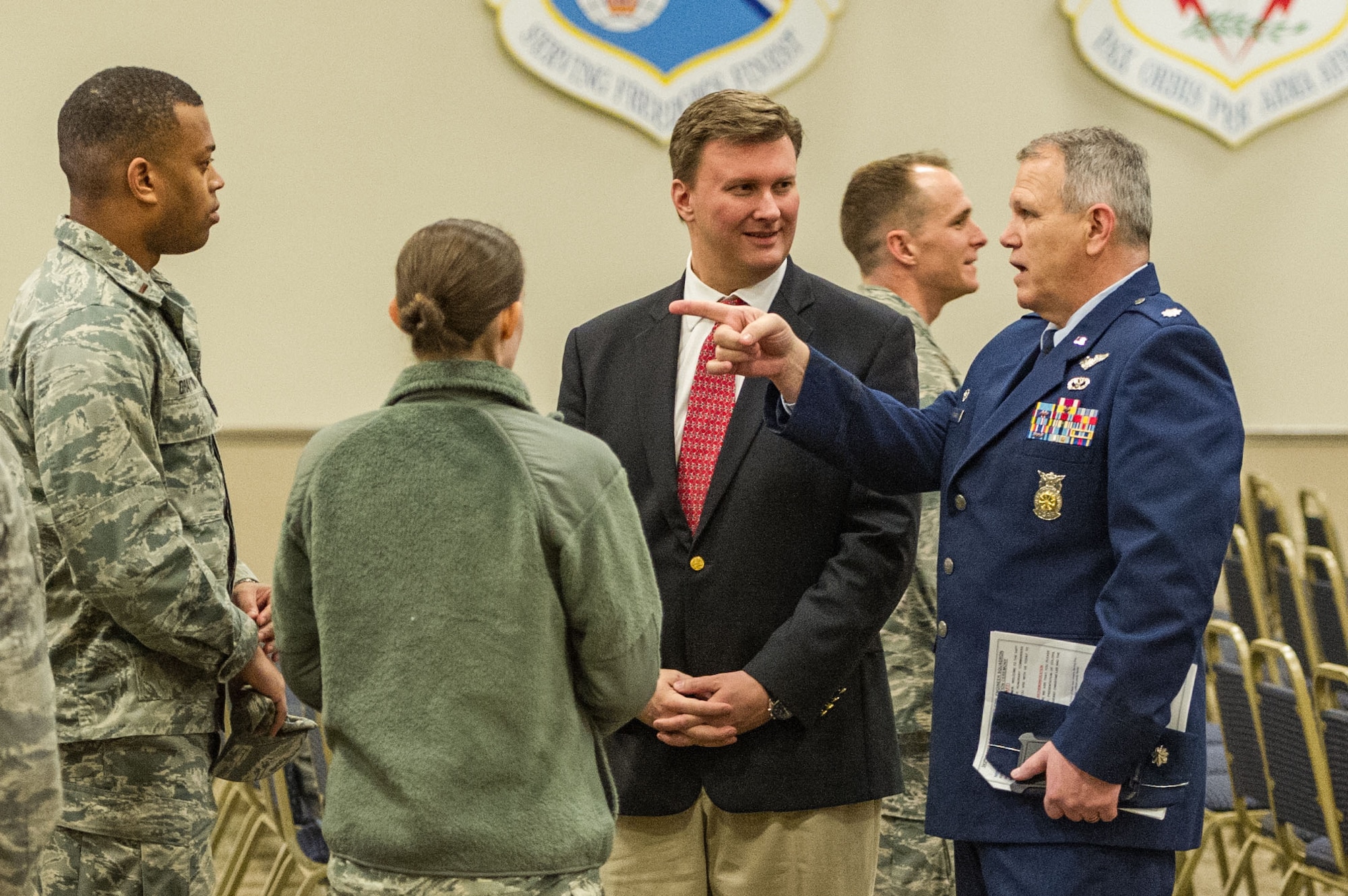 David R. Rockett, Jr., president of the Greater Bossier Economic Development Foundation, and Lt. Col. Alan Spiller, commander of the 307th Civil Engineer Squadron, talk with Airmen of the 307th CES before an honorary commander’s induction ceremony at Barksdale Air Force Base, Louisiana, March 3, 2018.