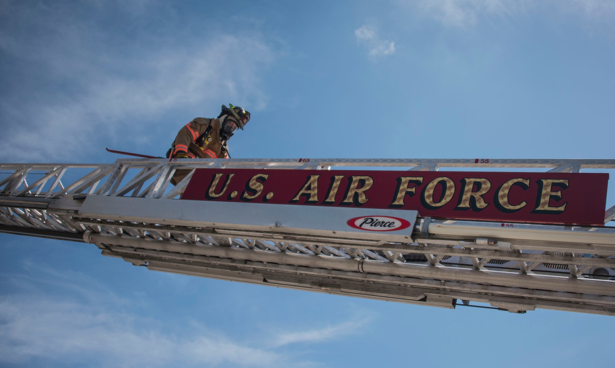 Firefighters from the 96th Civil Engineer Group rappelled from the top of their new structural training facility to cut the ribbon marking its official opening here March 1.