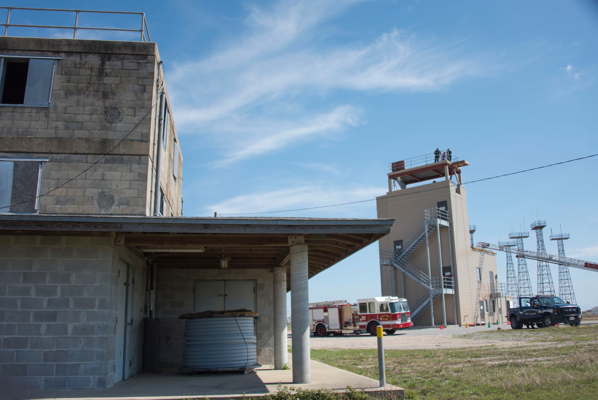 Firefighters from the 96th Civil Engineer Group rappelled from the top of their new structural training facility to cut the ribbon marking its official opening here March 1.