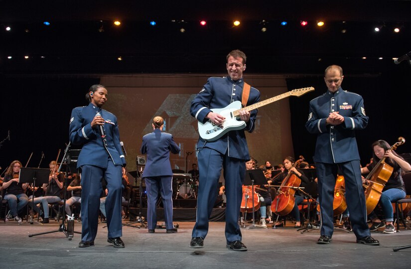 Musicians from the rock music group “Mobility” of The United States Air Force Band of the Golden West, Travis Air Force Base, Calif., perform with the Napa Valley Youth Symphony at the Veteran’s Home in Yountville, Calif., March 4, 2018. The band and symphony are performing together after the original concert, scheduled in October 2017, was canceled due to devastating wildfires in Napa and Sonoma counties. (U.S. Air Force photo by Louis Briscese)