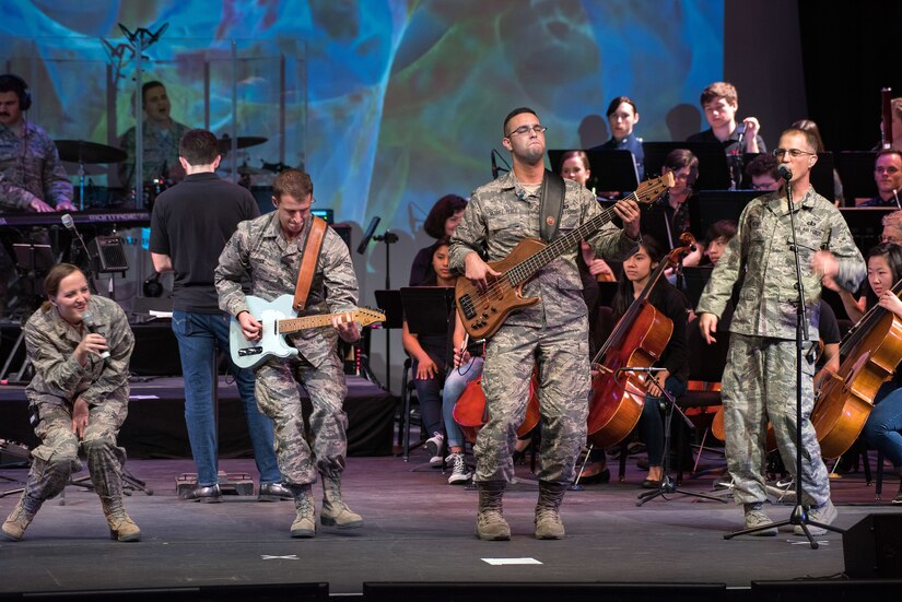 Musicians from the rock music group “Mobility” of The United States Air Force Band of the Golden West, Travis Air Force Base, Calif., perform with the Napa Valley Youth Symphony at the Veteran’s Home in Yountville, Calif., March 4, 2018. The band and symphony are performing together after the original concert, scheduled in October 2017, was canceled due to devastating wildfires in Napa and Sonoma counties. (U.S. Air Force photo by Louis Briscese)