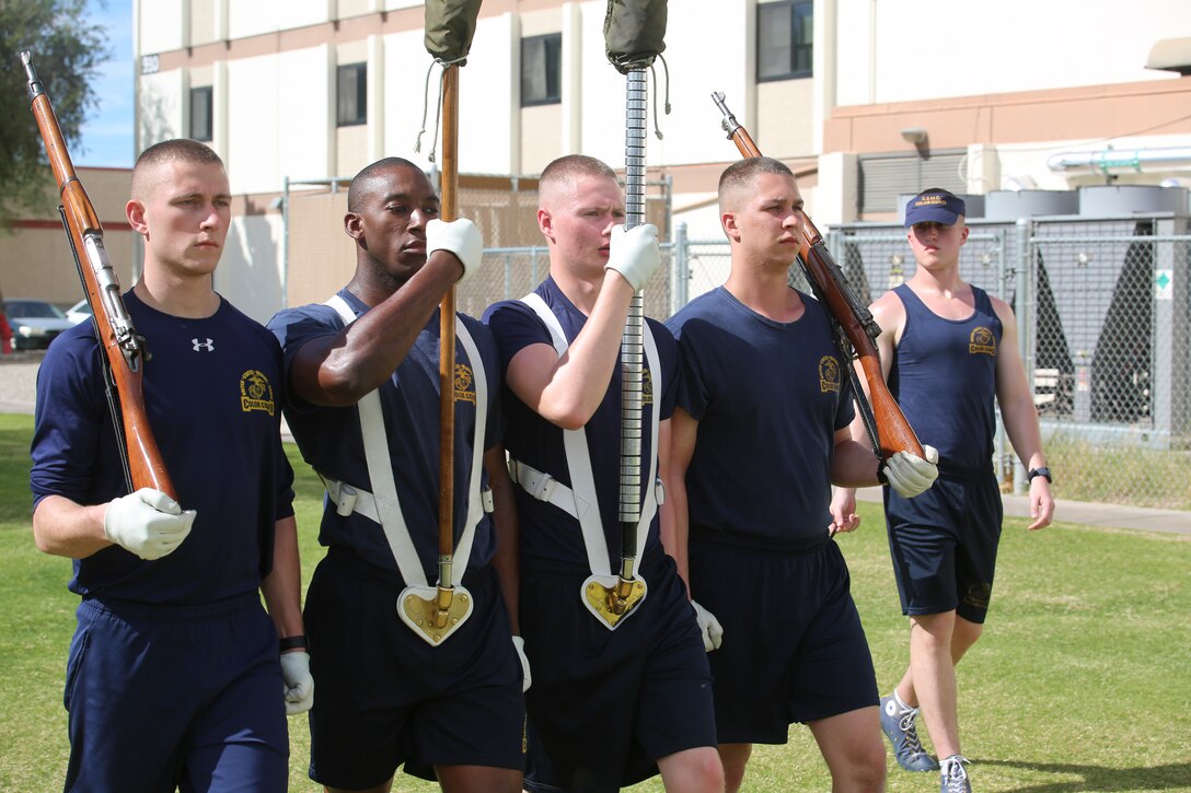 The U.S. Marine Corps Color Guard marches with the National Flag and the U.S. Marine Corps Battle Colors during the annual Battle Color Detachment training evolution at Marine Corps Air Station Yuma, Az., Feb. 17, 2018. The BCD consists of the Silent Drill Platoon, “The Commandant’s Own,” the United States Marine Drum & Bugle Corps and the Marine Corps Color Guard. The BCD conducts this training in order to refine and reform drill movements and performances for this upcoming West Coast Tour and 2018 parade season. (Official Marine Corps photo by Cpl. Damon Mclean/Released)