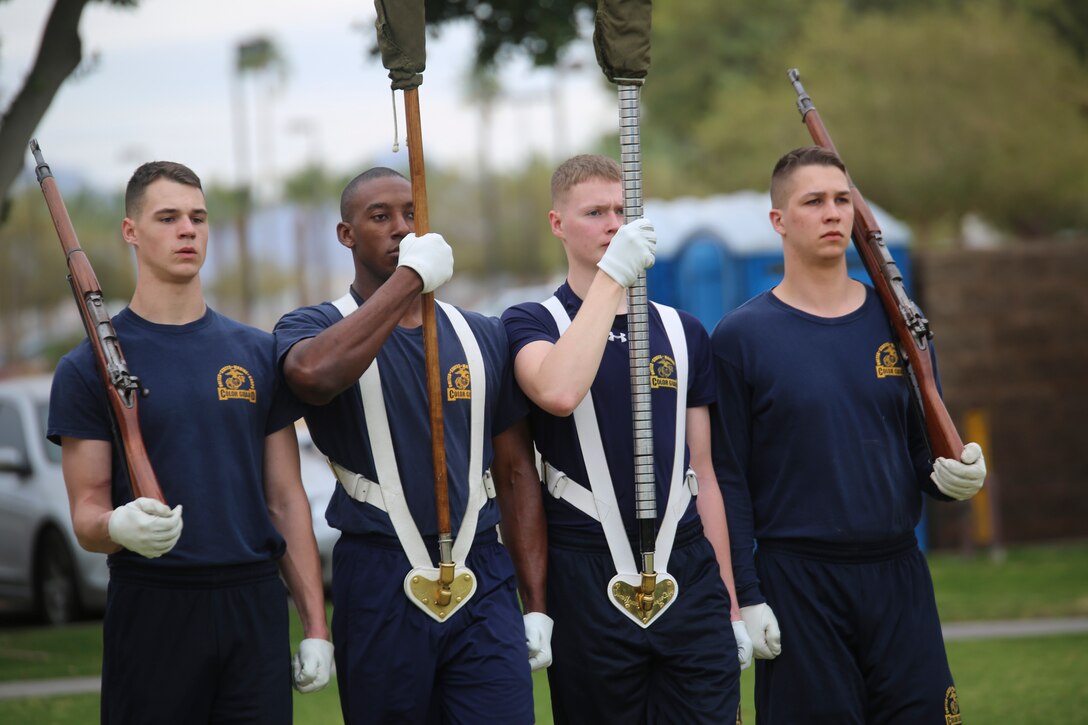The U.S. Marine Corps Color Guard marches with the National Flag and the U.S. Marine Corps Battle Colors during the annual U.S. Marine Corps Battle Color Detachment training evolution at Marine Corps Air Station Yuma, Az., Feb. 14, 2018. The BCD consists of the U.S. Marine Corps Silent Drill Platoon, “The Commandant’s Own,” U.S. Marine Drum & Bugle Corps, and the U.S. Marine Corps Color Guard. The BCD conducts this annual training to refine and reform drill movements and drill sequences for their upcoming West Coast Tour and the 2018 2018 parade season. (Official Marine Corps photo by Cpl. Damon A. Mclean/Released)