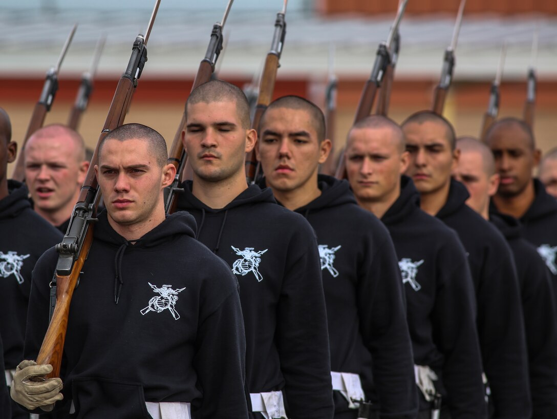 Marines with the U.S. Marine Corps Silent Drill Platoon march in formation during the annual U.S. Marine Corps Battle Color Detachment training evolution at Marine Corps Air Station Yuma, Az., Feb. 14, 2018. The BCD consists of the Silent Drill Platoon, “The Commandant’s Own,” U.S. Marine Drum & Bugle Corps, and the U.S. Marine Corps Color Guard. The BCD conducts this training in order to refine and reform drill movements and performances for this upcoming West Coast Tour and 2018 parade season. (Official Marine Corps photo by Cpl. Damon A. Mclean/Released)