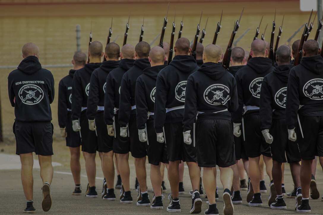 Marines with the U.S. Marine Corps Silent Drill Platoon march in formation during the annual Battle Color Detachment training evolution at Marine Corps Air Station Yuma, Az., Feb. 14, 2018. The BCD consists of the Silent Drill Platoon, “The Commandant’s Own,” the United States Marine Drum & Bugle Corps and the Marine Corps Color Guard. The BCD conducts this training in order to refine and reform drill movements and performances for this upcoming West Coast Tour and 2018 parade season. (Official Marine Corps photo by Cpl. Damon A. Mclean/Released)