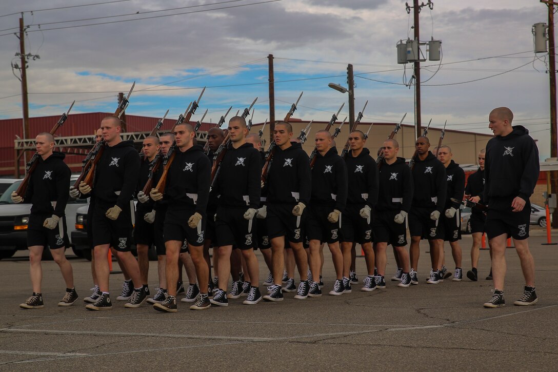 Marines with the U.S. Marine Corps Silent Drill Platoon march in formation during the annual Battle Color Detachment training evolution at Marine Corps Air Station Yuma, Az., Feb. 14, 2018. The BCD consists of the Silent Drill Platoon, “The Commandant’s Own,” the United States Marine Drum & Bugle Corps and the Marine Corps Color Guard. The BCD conducts this training in order to refine and reform drill movements and performances for this upcoming West Coast Tour and 2018 parade season.(Official Marine Corps photo by Cpl. Damon A. Mclean/Released)