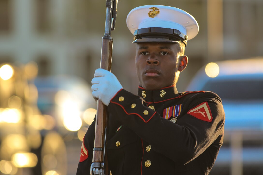 A Marine with the U.S. Marine Corps Silent Drill Platoon executes precision rifle drill movements while being evaluated during the platoon’s “Challenge Day” at Marine Corps Air Station Yuma, Az., Feb. 26, 2018. Each Marine performed the scripted throws, spins and drill movements while the drill master and rifle inspectors evaluated the Marines to choose the rifle inspection team for 2018 parade season.  The Marines were chosen based on several factors; including bearing, uniforms, and proficiency.(Official Marine Corps photo by Cpl. Damon A. Mclean/Released)