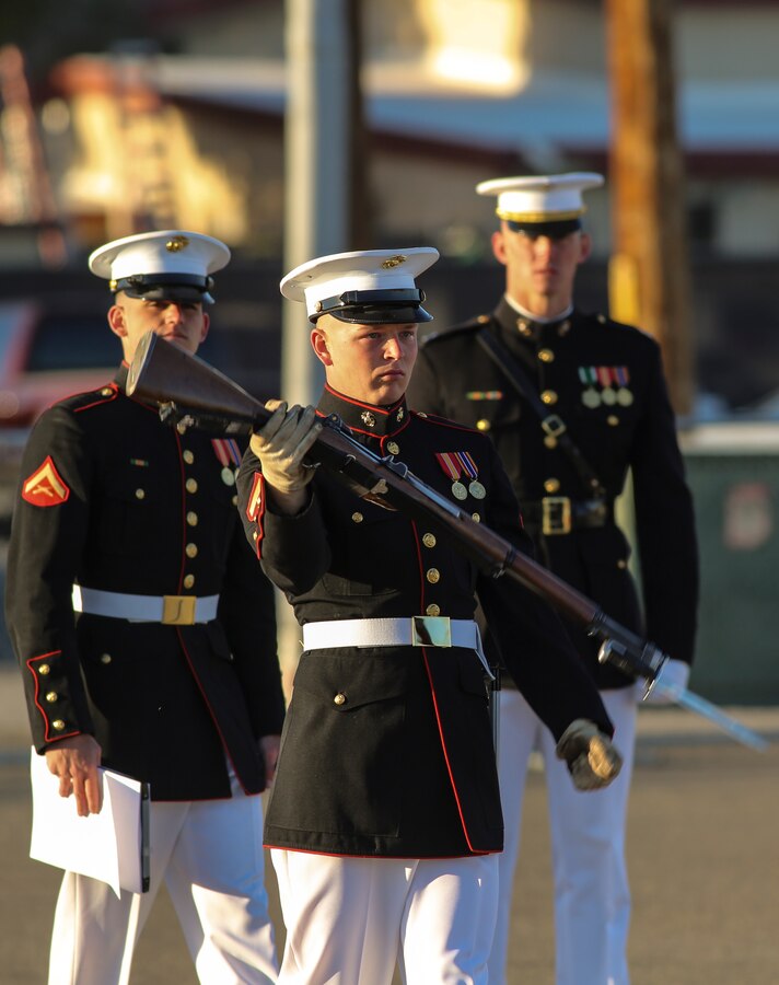 A Marine with the U.S. Marine Corps Silent Drill Platoon executes precision rifle drill movements while being evaluated during the platoon’s “Challenge Day” at Marine Corps Air Station Yuma, Az., Feb. 26, 2018. Each Marine performed the scripted throws, spins and drill movements while the drill master and rifle inspectors evaluated the Marines to choose the rifle inspection team for 2018 parade season.  The Marines were chosen based on several factors; including bearing, uniforms, and proficiency.(Official Marine Corps photo by Cpl. Damon A. Mclean/Released)