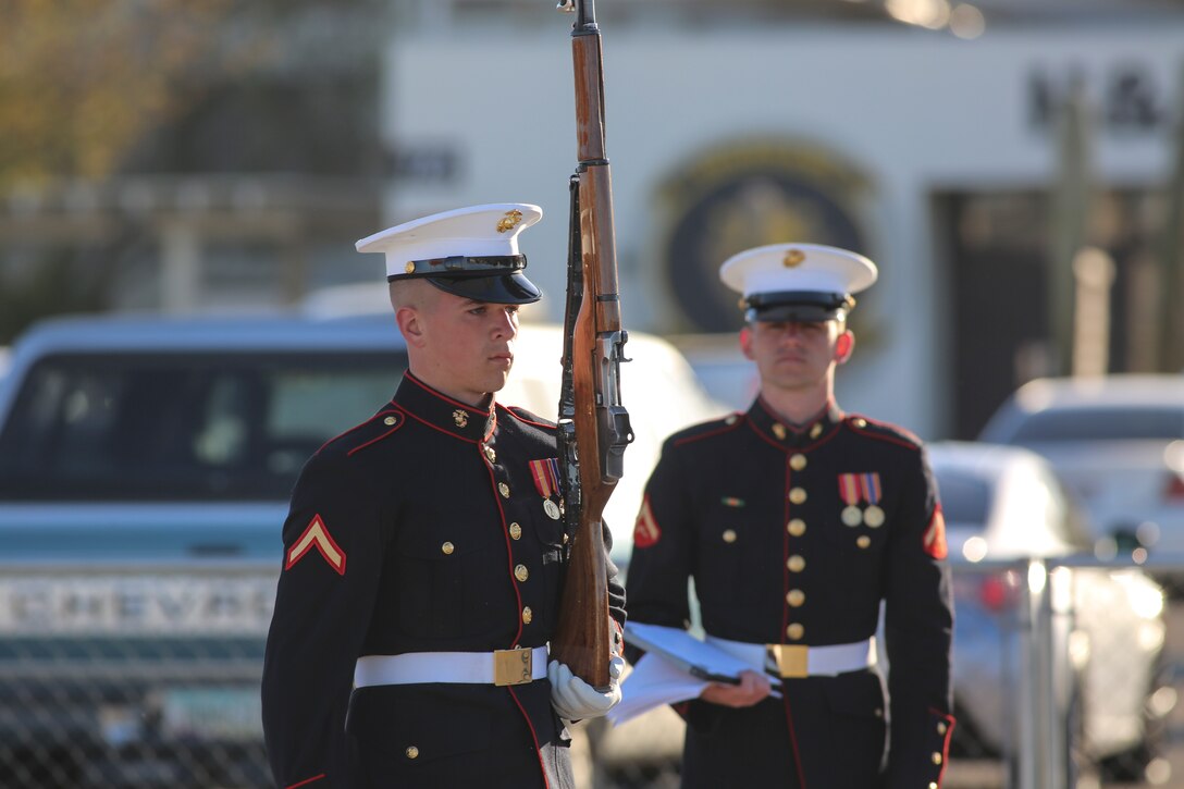 A Marine with the U.S. Marine Corps Silent Drill Platoon executes precision rifle drill movements while being evaluated during the platoon’s “Challenge Day” at Marine Corps Air Station Yuma, Az., Feb. 26, 2018. Each Marine performed the scripted throws, spins and drill movements while the drill master and rifle inspectors evaluated the Marines to choose the rifle inspection team for 2018 parade season.  The Marines were chosen based on several factors; including bearing, uniforms, and proficiency.(Official Marine Corps photo by Cpl. Damon A. Mclean/Released)