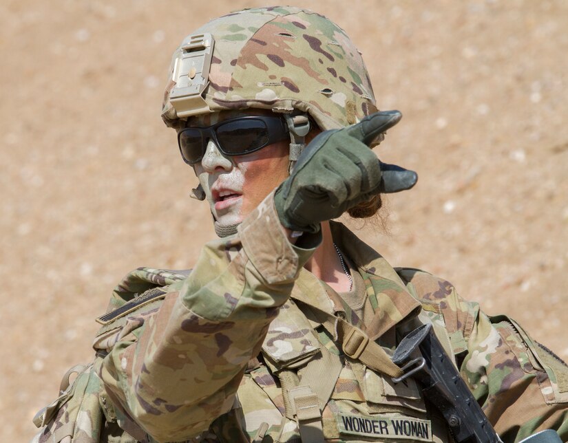 Sergeant Natasia White, a team leader, Delta Battery, 1st Battalion, 145th Field Artillery Regiment, urges her team to push forward in pursuit of their objective during an urban operations training exercise near Camp Buehring, Kuwait, Feb. 28, 2018.