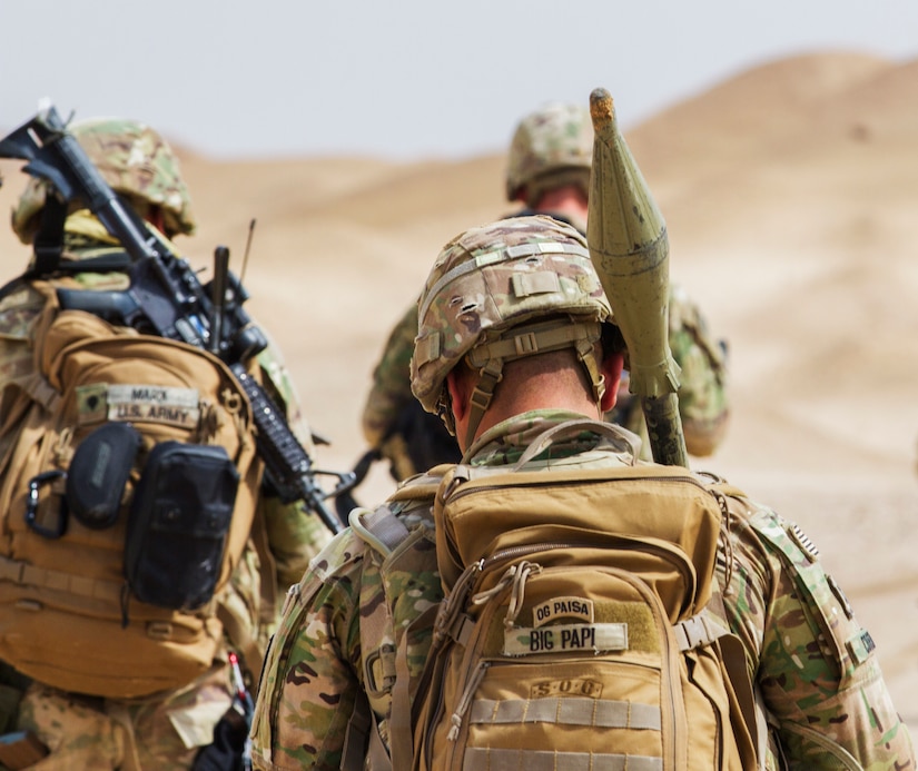 Artillerymen of the Delta Battery, 1st Battalion, 145th Field Artillery Regiment walk back to the UH-60 helicopter landing zone following a successful urban operations training at a base near Camp Buehring, Kuwait, Feb. 28, 2018.