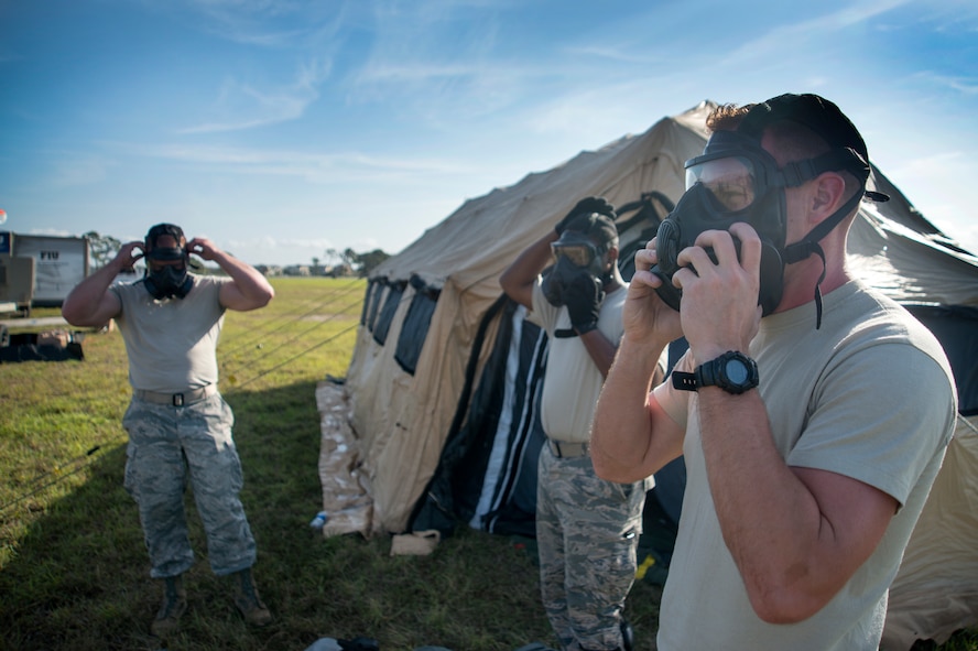 U.S. Air Force Airmen assigned to the 46th Aerial Port Squadron (APS) at Dover Air Force Base, Del., test out their equipment at MacDill Air Force Base, Fla., Feb. 28, 2018
