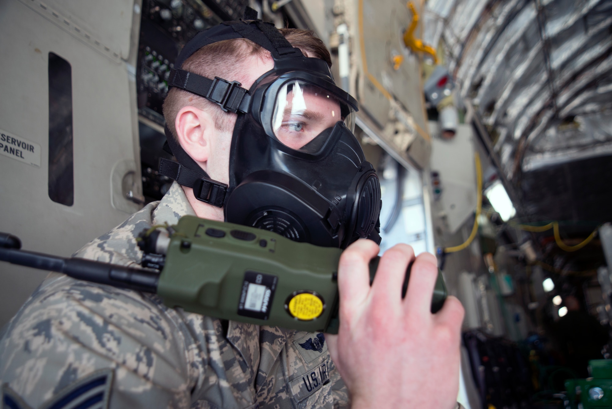 U.S. Air Force Staff Sgt. Daniel Miller, a loadmaster and ramp coordinator assigned to the 512th Contingency Response Squadron (CRS) at Dover Air Force Base, Del., communicates via radio to a hardside expandable light air mobility shelter (HELAMS) at MacDill Air Force Base, Fla., Feb. 28, 2018.