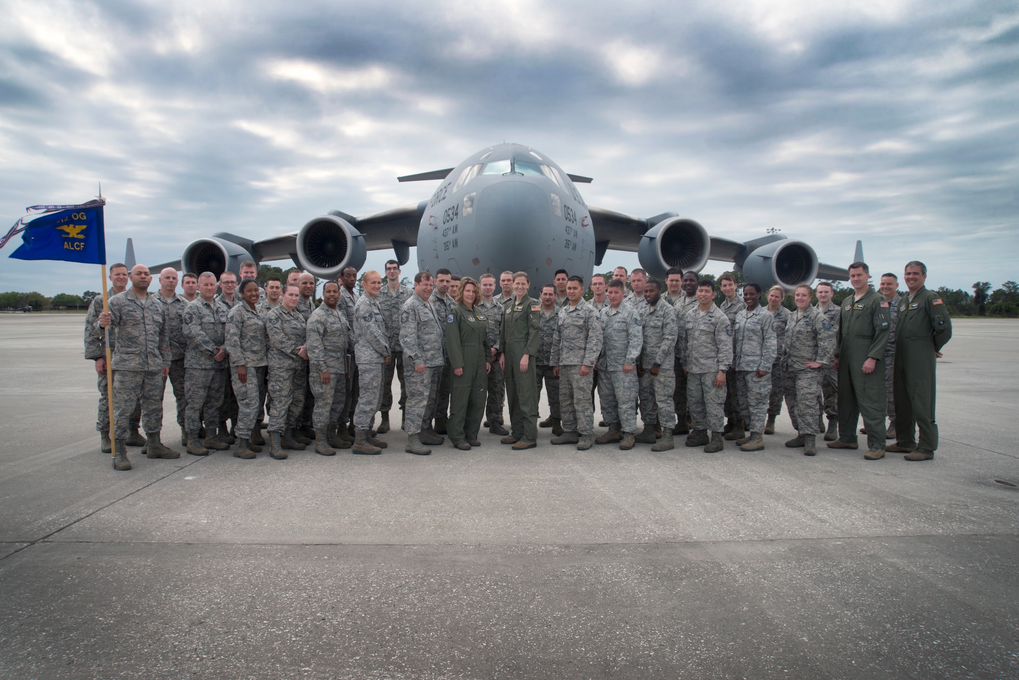 U.S. Air Force Airmen assigned to the 46th Aerial Port Squadron, 512th Contingency Response Squadron and 712th Aircraft Maintenance Squadron at Dover Air Force Base, Del., pause for a photo at MacDill Air Force Base, Fla., March 2, 2018.
